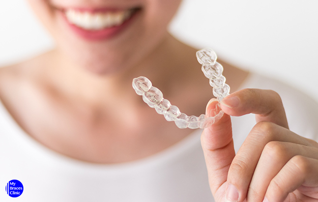 A Woman Holding a Dental Invisalign